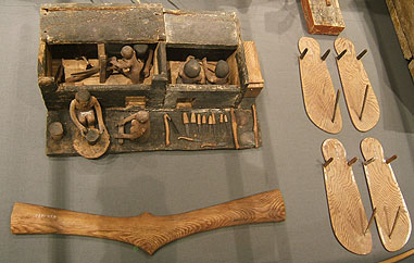 Ancient Egyptian throwing stick and sandals